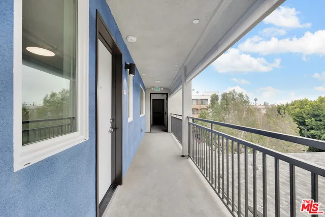 a view of a living room with a large window