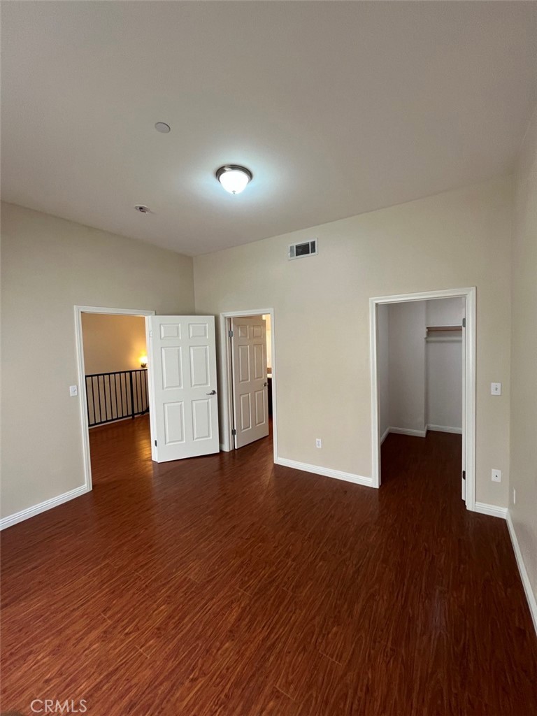 920 Central Riverside, CA 92507 - Photo 2 of 40 a view of an empty room with wooden floor and closet
