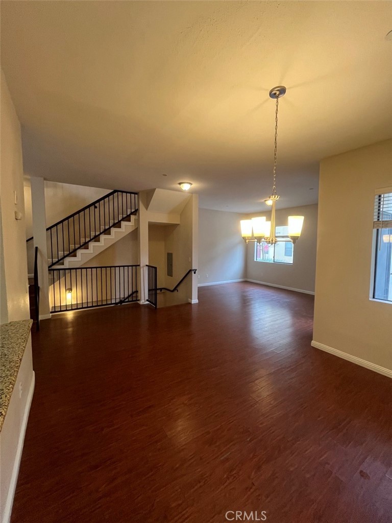 920 Central Riverside, CA 92507 - Photo 22 of 40 a view of an empty room with wooden floor fire place and windows