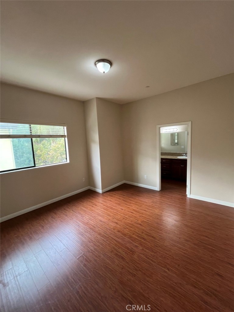 920 Central Riverside, CA 92507 - Photo 33 of 40 an empty room with wooden floor and windows