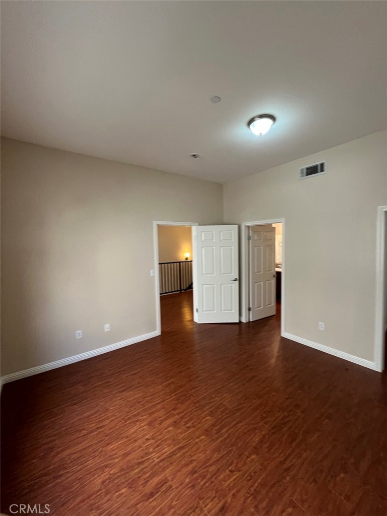 920 Central Riverside, CA 92507 - Photo 10 of 40 a view of an empty room and wooden floor and cabinet