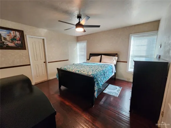 a living room with a bed furniture and a window