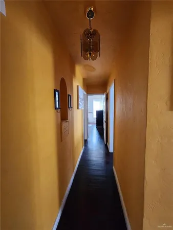 a view of a hallway with front door