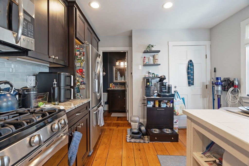 33 Mystic Street, Unit 3 Boston, MA 02129 - Photo 6 of 21 a kitchen with stainless steel appliances granite countertop a stove and a refrigerator
