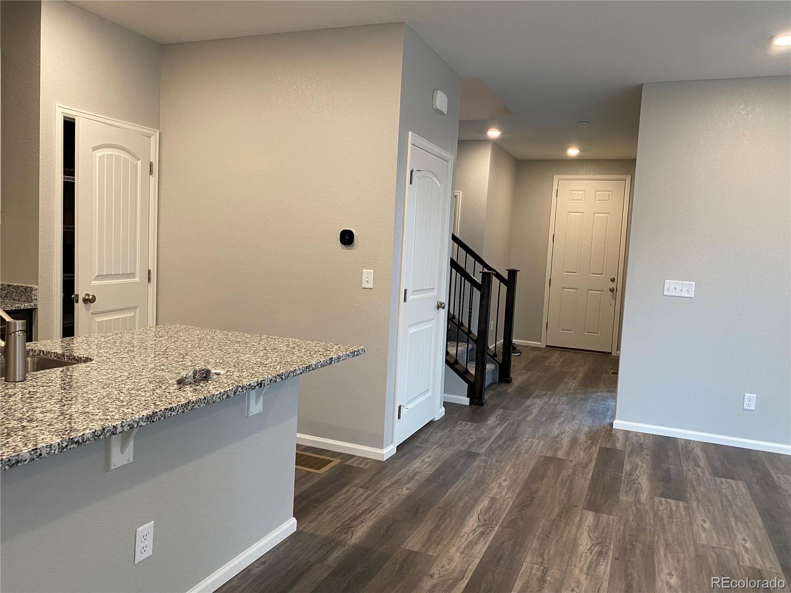 21250 East Radcliff Place Aurora, CO 80015 - Photo 11 of 11 a view of a kitchen from the hallway