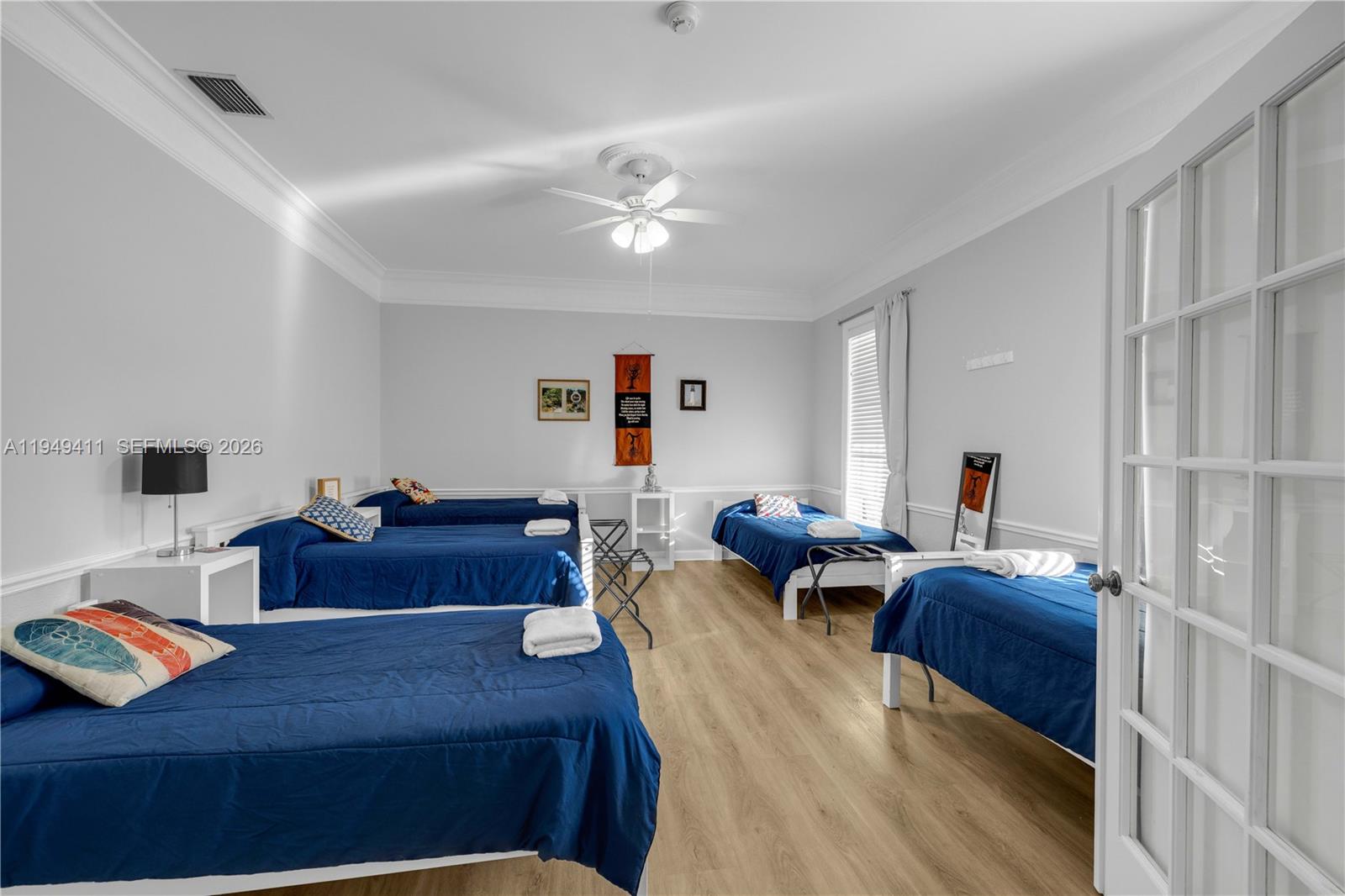 27950 Southwest 182nd Avenue Homestead, FL 33031 - Photo 12 of 49 a living room with furniture and wooden floor