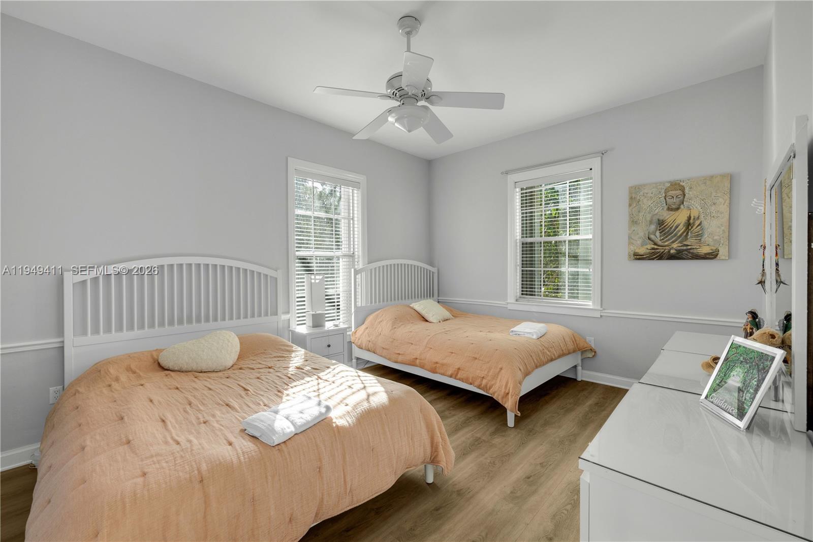 27950 Southwest 182nd Avenue Homestead, FL 33031 - Photo 15 of 49 a bedroom with two beds and a window