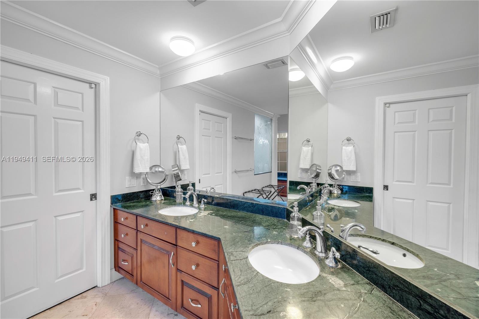 27950 Southwest 182nd Avenue Homestead, FL 33031 - Photo 18 of 49 a bathroom with double vanity sink and a mirror