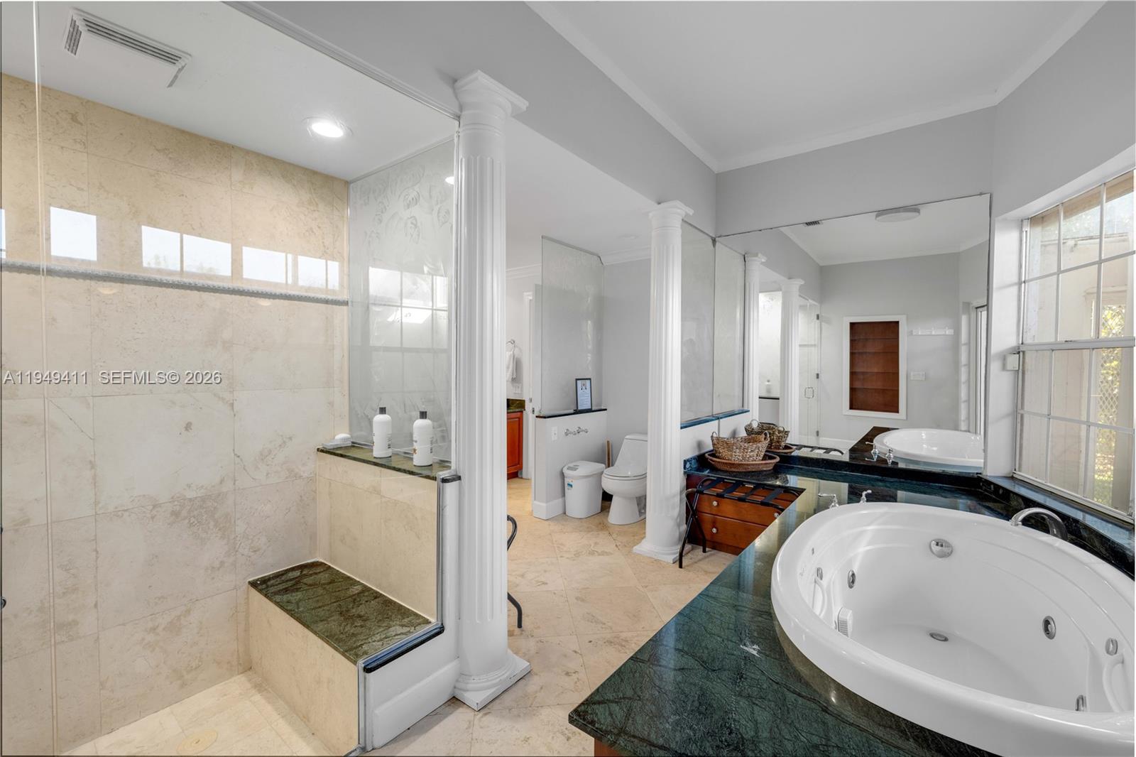 27950 Southwest 182nd Avenue Homestead, FL 33031 - Photo 19 of 49 a spacious bathroom with a tub sink and mirror