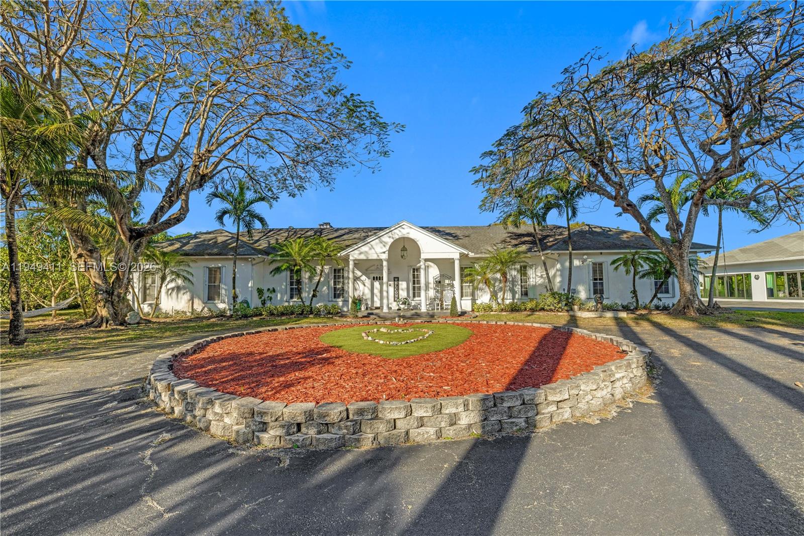27950 Southwest 182nd Avenue Homestead, FL 33031 - Photo 2 of 49 a view of a yard with cars