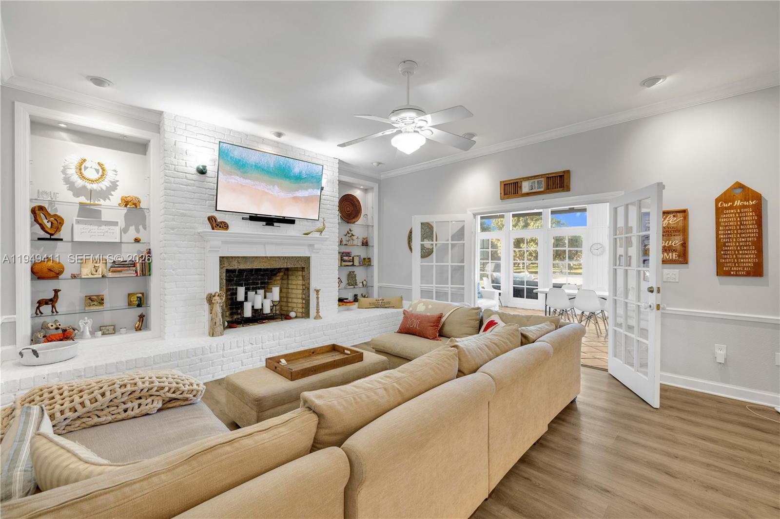 27950 Southwest 182nd Avenue Homestead, FL 33031 - Photo 21 of 49 a living room with furniture fireplace and flat screen tv