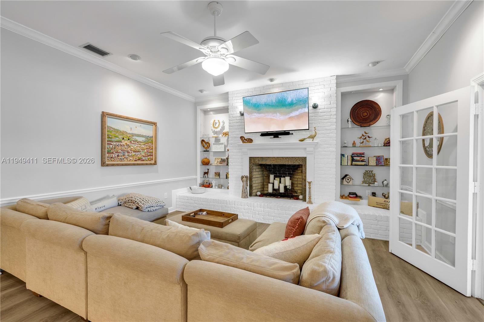 27950 Southwest 182nd Avenue Homestead, FL 33031 - Photo 22 of 49 a living room with furniture a fireplace and a large window
