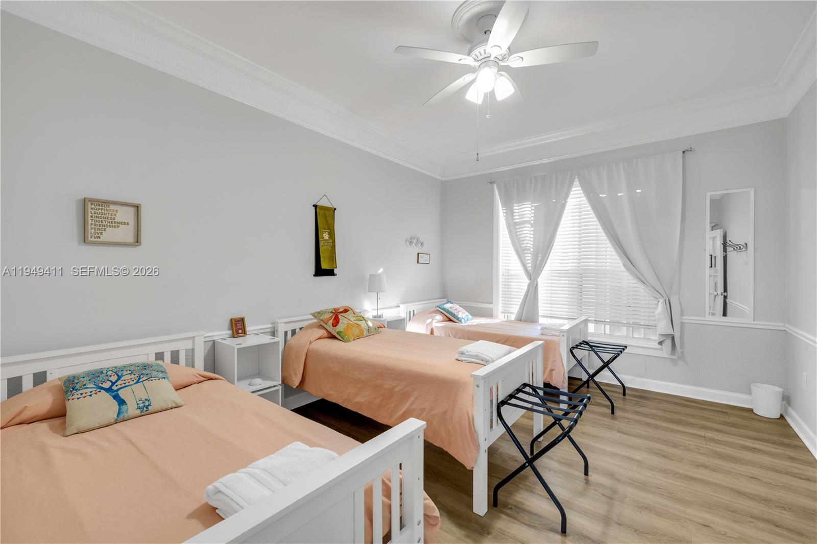 27950 Southwest 182nd Avenue Homestead, FL 33031 - Photo 29 of 49 a bedroom with two beds and a table