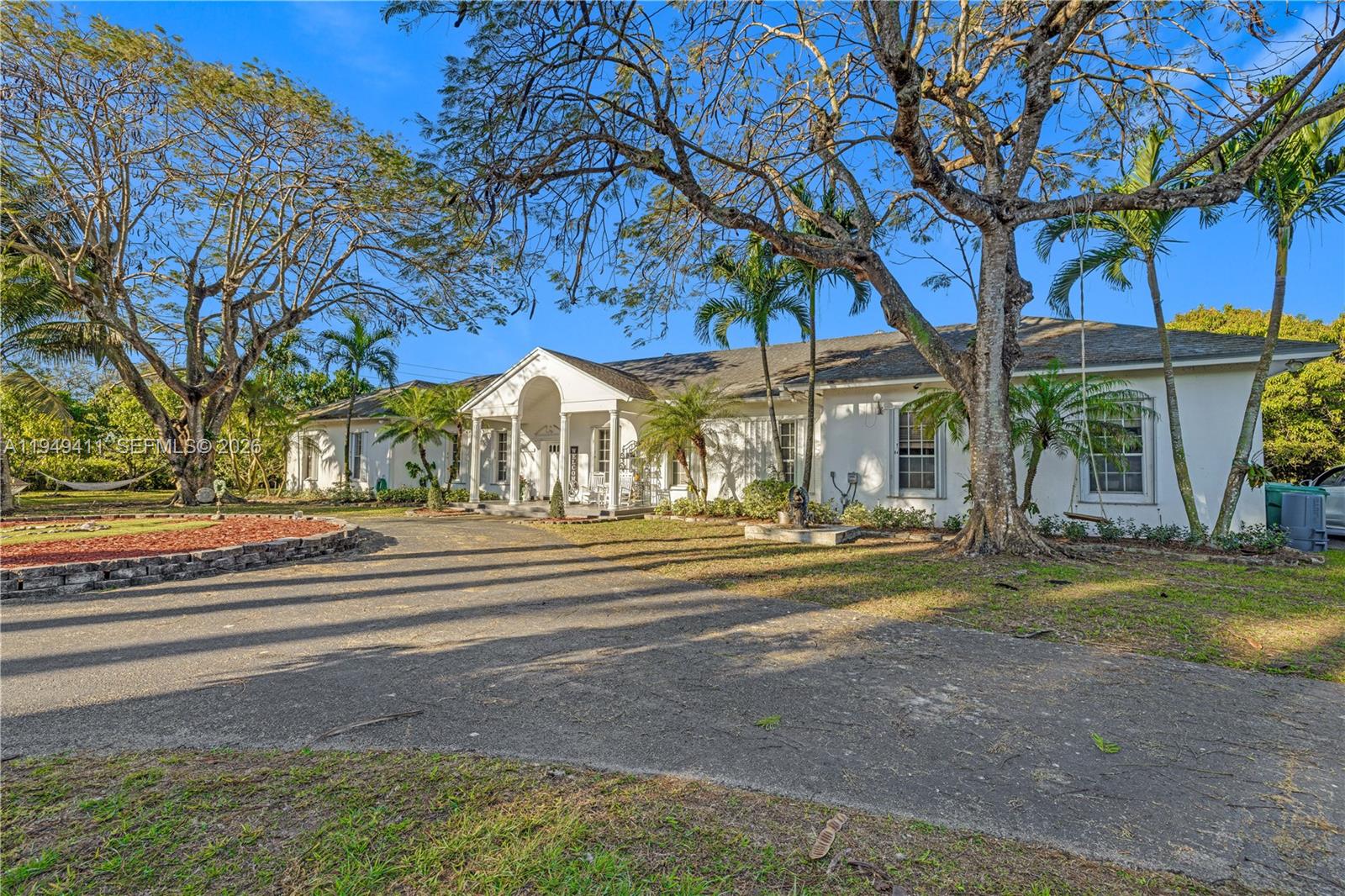 27950 Southwest 182nd Avenue Homestead, FL 33031 - Photo 3 of 49 a view of park with large trees