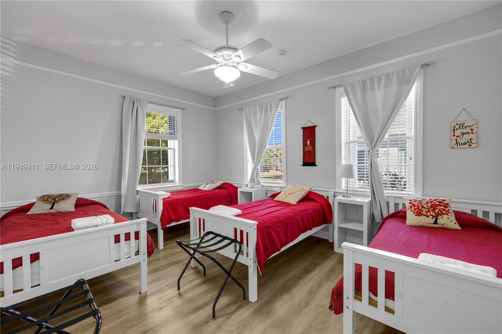 27950 Southwest 182nd Avenue Homestead, FL 33031 - Photo 32 of 49 a bedroom with a bed and window