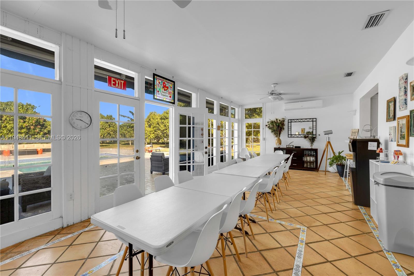 27950 Southwest 182nd Avenue Homestead, FL 33031 - Photo 33 of 49 a living room with furniture a rug and a table