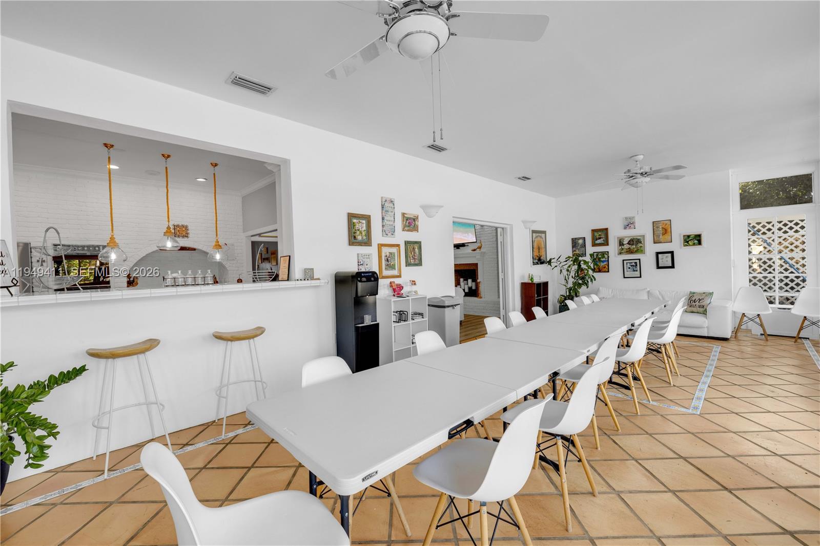 27950 Southwest 182nd Avenue Homestead, FL 33031 - Photo 34 of 49 a living room with furniture a dining table and kitchen view