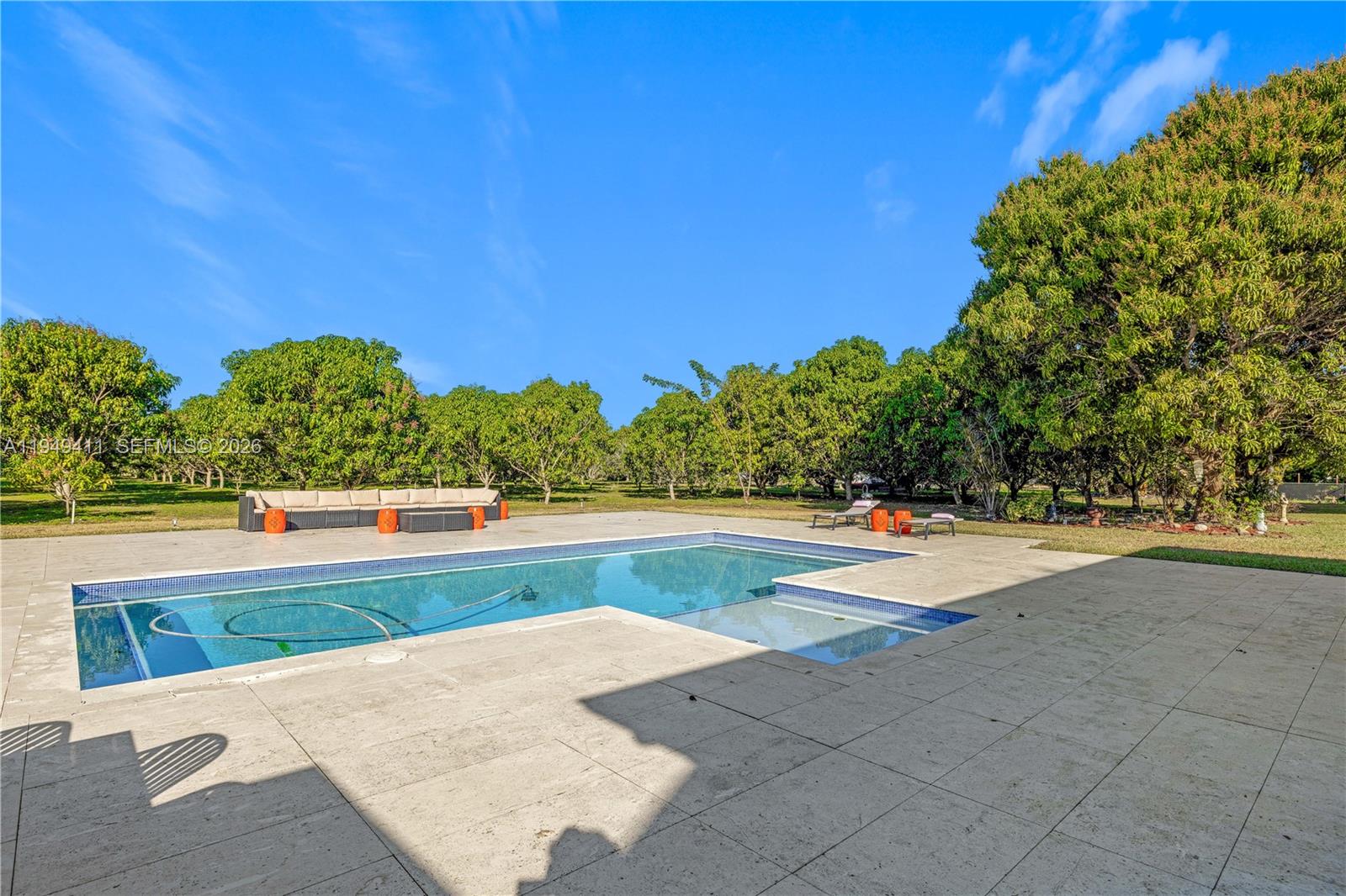27950 Southwest 182nd Avenue Homestead, FL 33031 - Photo 35 of 49 a view of swimming pool with outdoor seating and yard