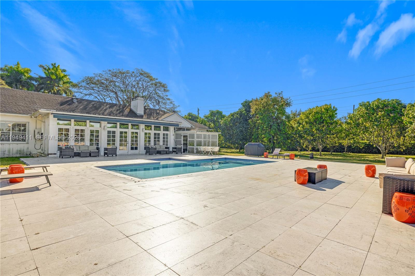 27950 Southwest 182nd Avenue Homestead, FL 33031 - Photo 37 of 49 a view of a swimming pool with a patio