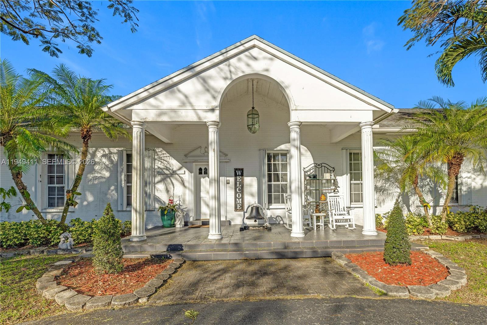 27950 Southwest 182nd Avenue Homestead, FL 33031 - Photo 4 of 49 a view of a house with a porch