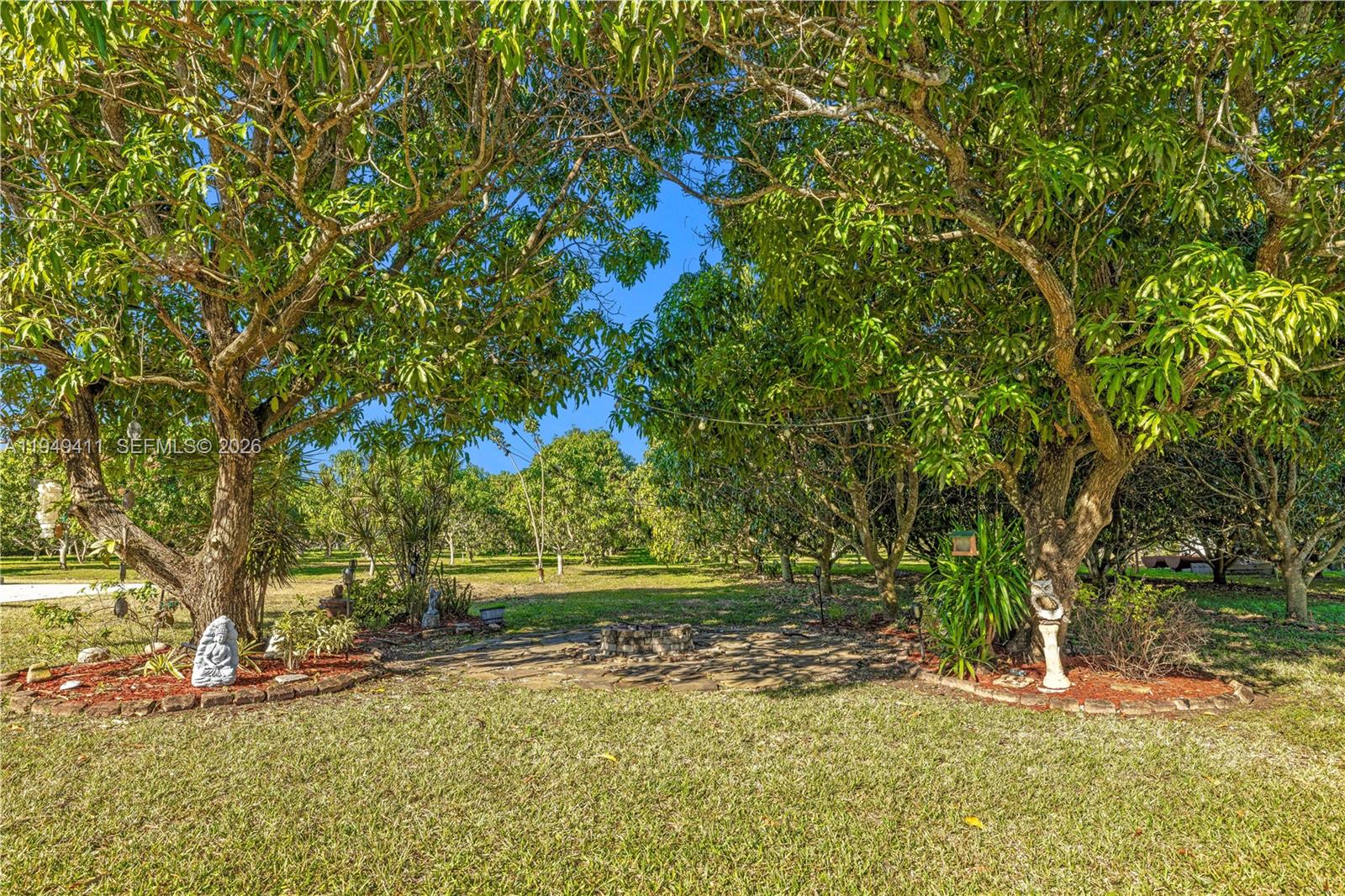 27950 Southwest 182nd Avenue Homestead, FL 33031 - Photo 42 of 49 a view of a yard with a tree