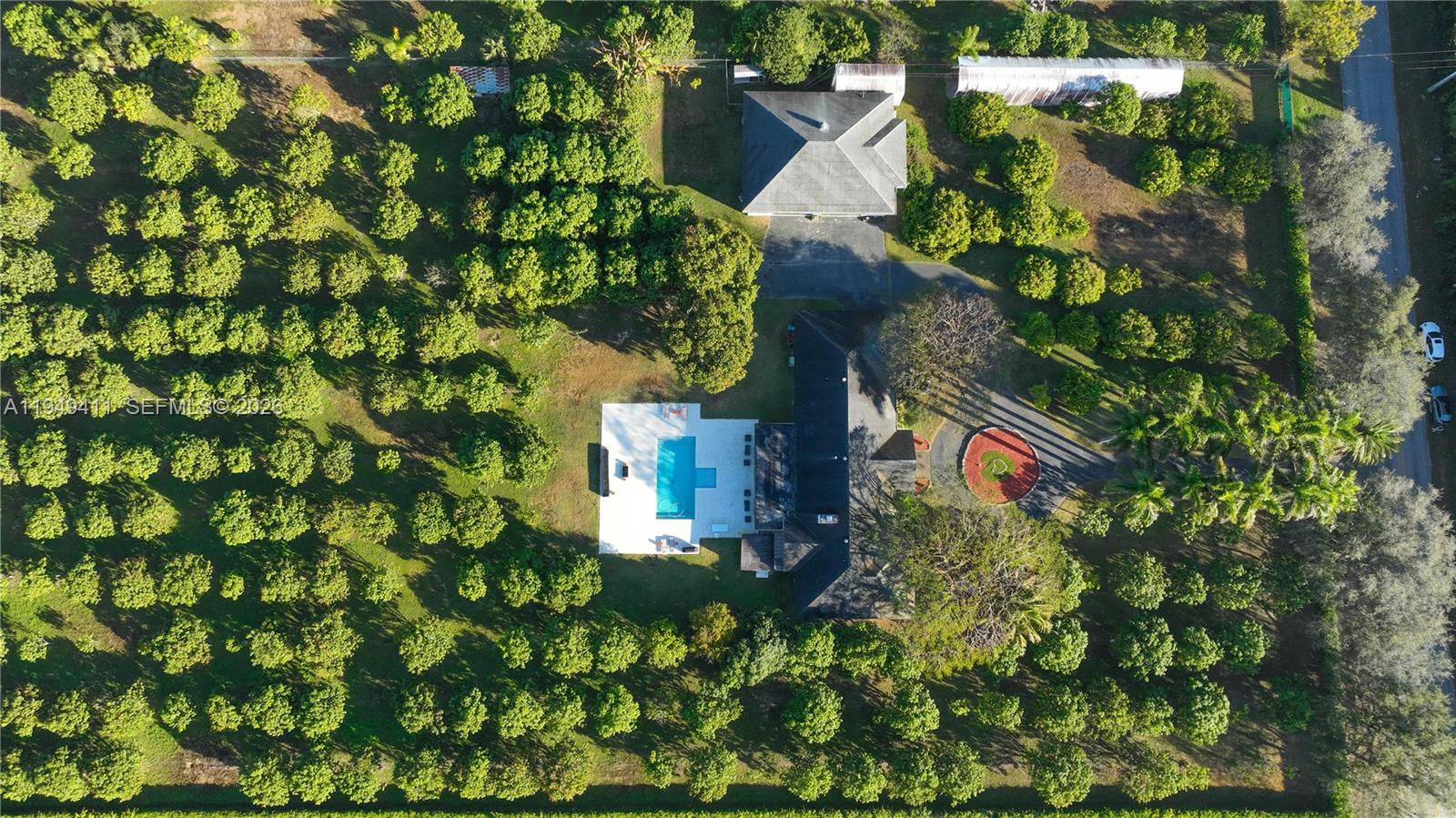 27950 Southwest 182nd Avenue Homestead, FL 33031 - Photo 47 of 49 an aerial view of a house with a yard