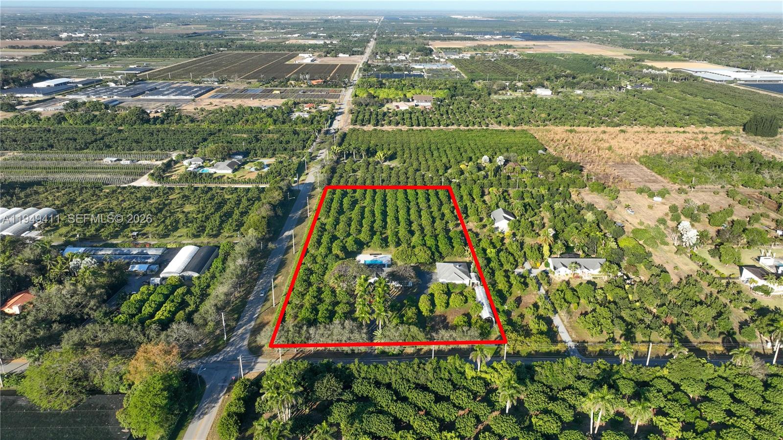 27950 Southwest 182nd Avenue Homestead, FL 33031 - Photo 48 of 49 an aerial view of residential houses with outdoor space and river