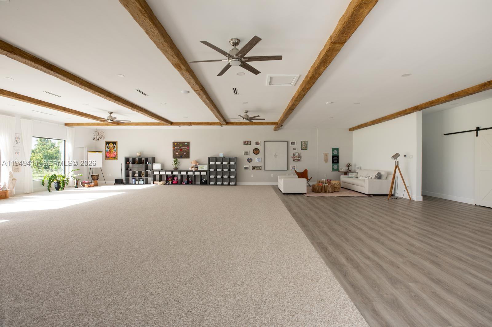 27950 Southwest 182nd Avenue Homestead, FL 33031 - Photo 5 of 49 a view of a livingroom with furniture and a ceiling fan
