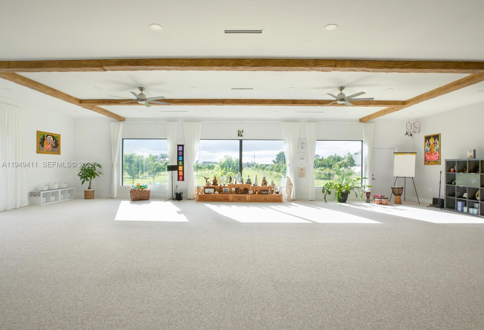 27950 Southwest 182nd Avenue Homestead, FL 33031 - Photo 6 of 49 a living room with furniture and a large window