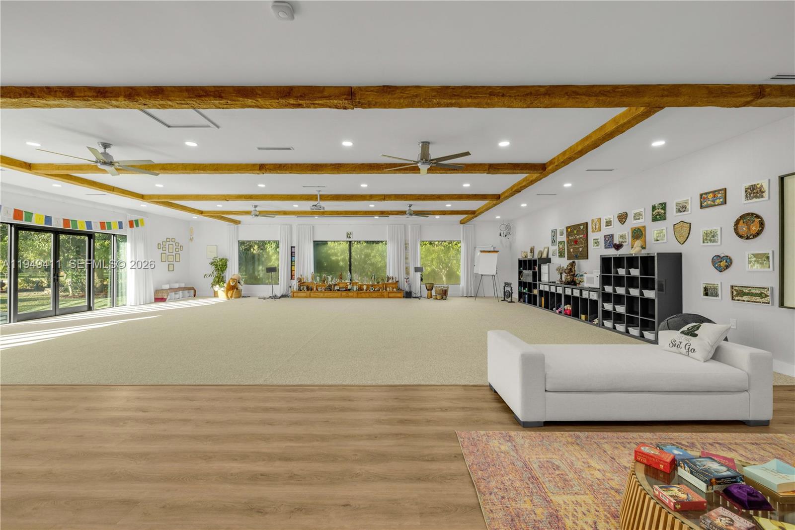 27950 Southwest 182nd Avenue Homestead, FL 33031 - Photo 8 of 49 a living room with furniture and a floor to ceiling window