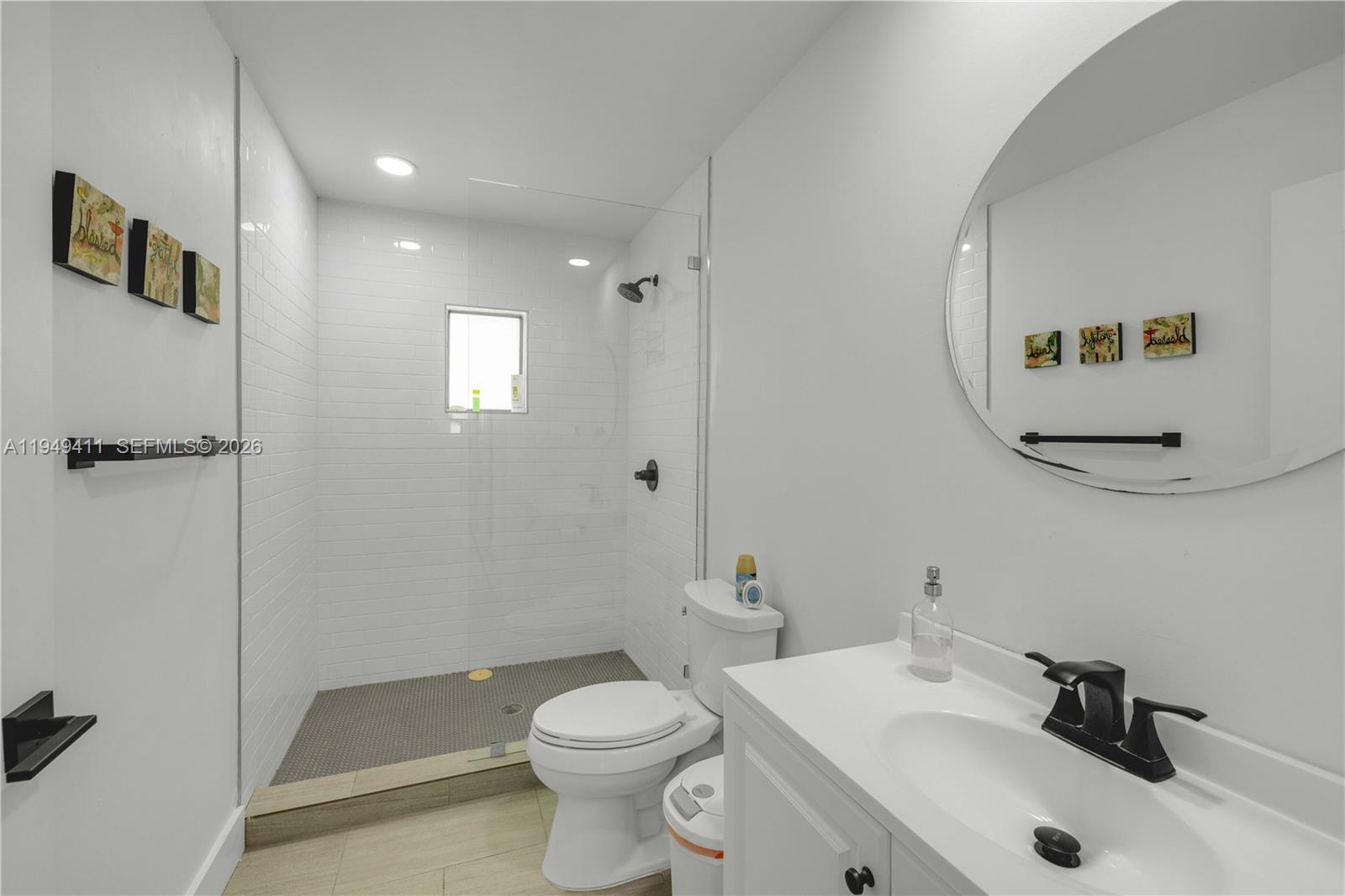 27950 Southwest 182nd Avenue Homestead, FL 33031 - Photo 9 of 49 a bathroom with a sink and a mirror