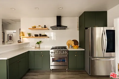 a view of a kitchen cabinets and wooden floor