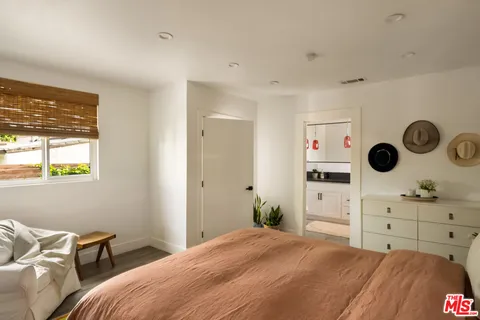 a bathroom with a shower and a sink
