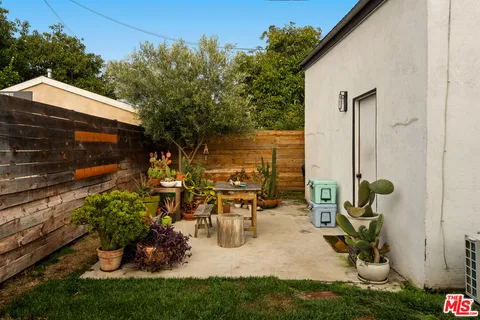 a view of a chairs and table in a patio