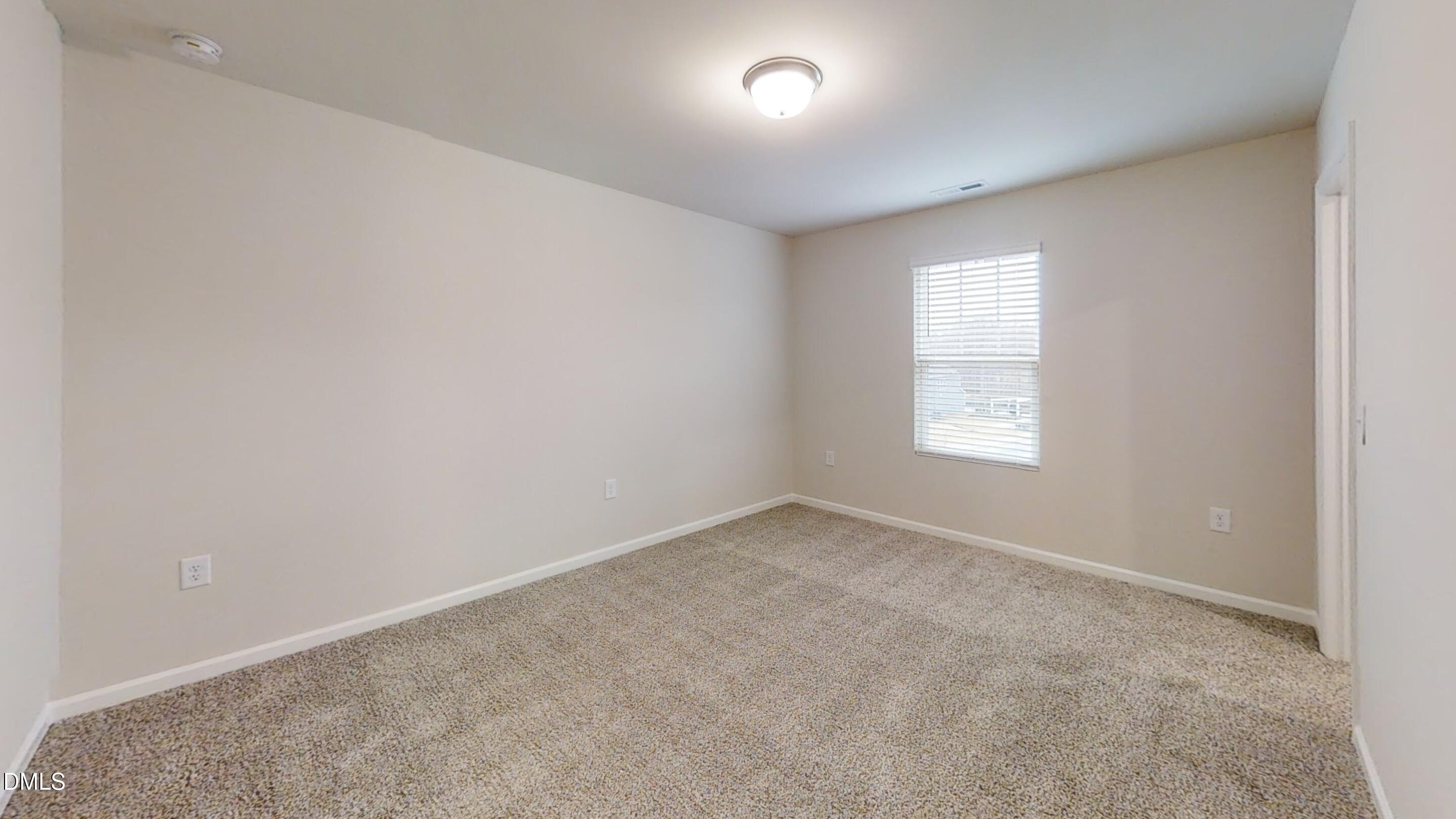 46 Coffee Tree Circle Clayton, NC 27527 - Photo 9 of 46 an empty room with a window