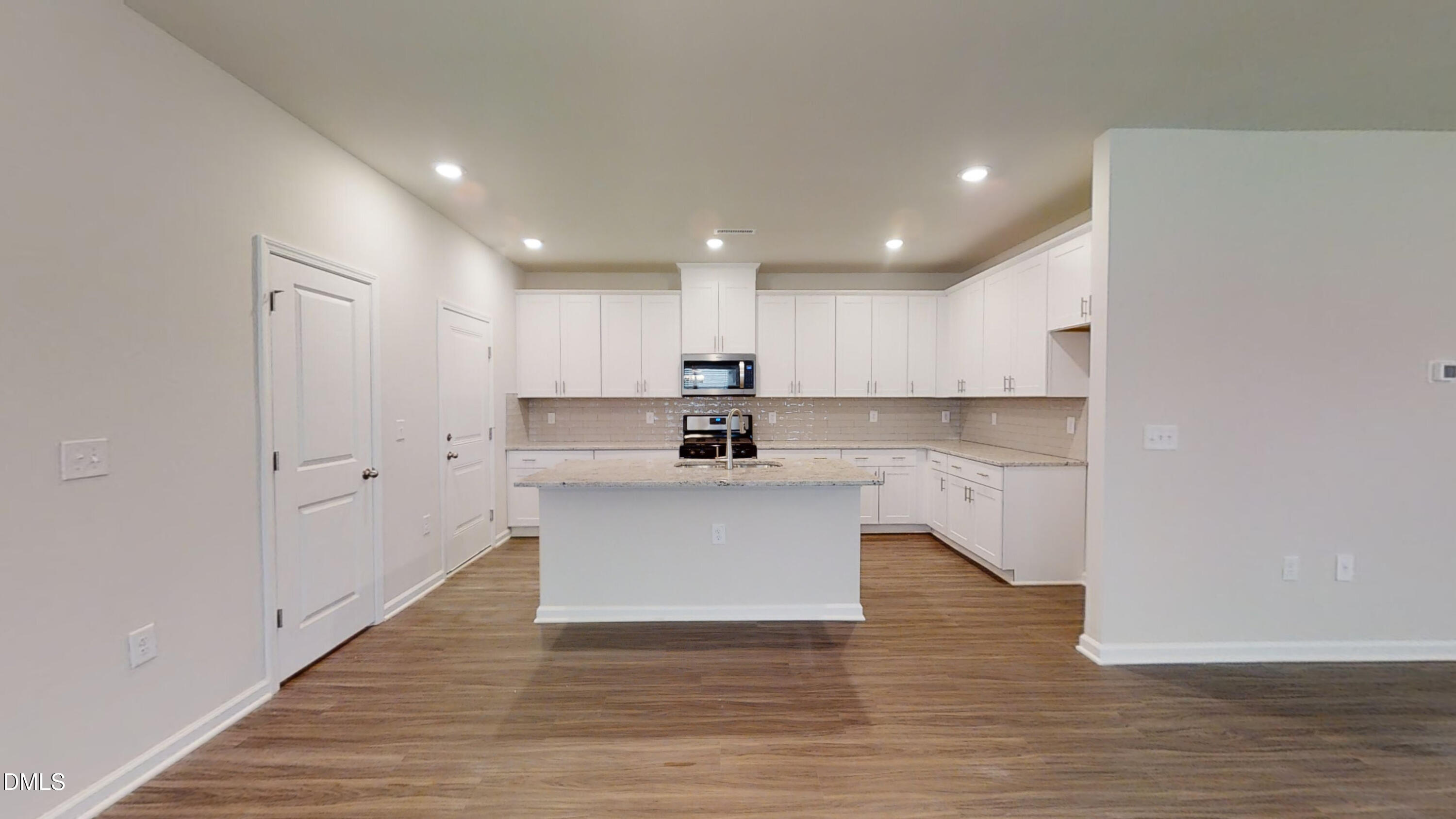 46 Coffee Tree Circle Clayton, NC 27527 - Photo 12 of 46 a view of kitchen with wooden floor