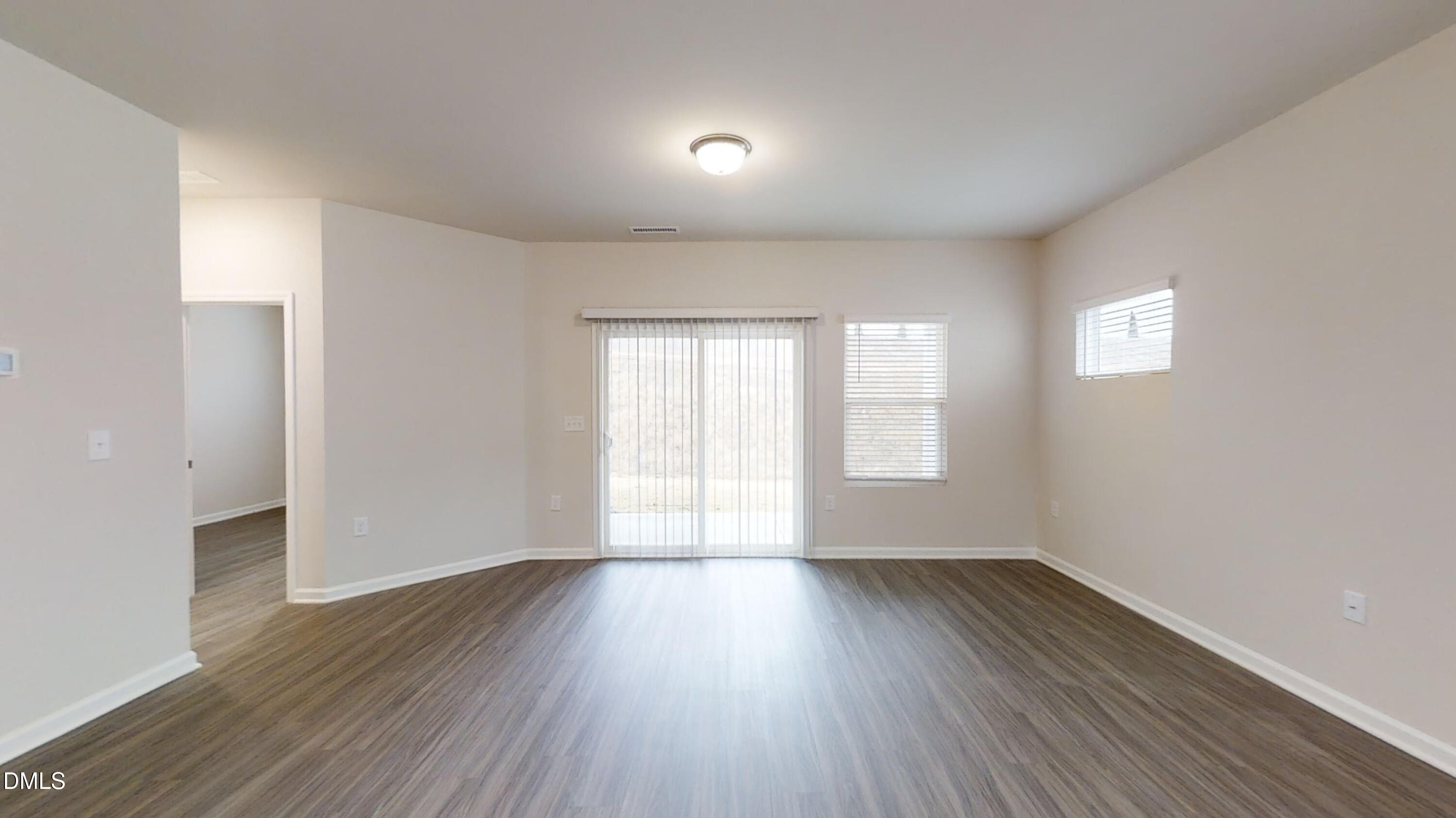 46 Coffee Tree Circle Clayton, NC 27527 - Photo 16 of 46 an empty room with wooden floor and windows