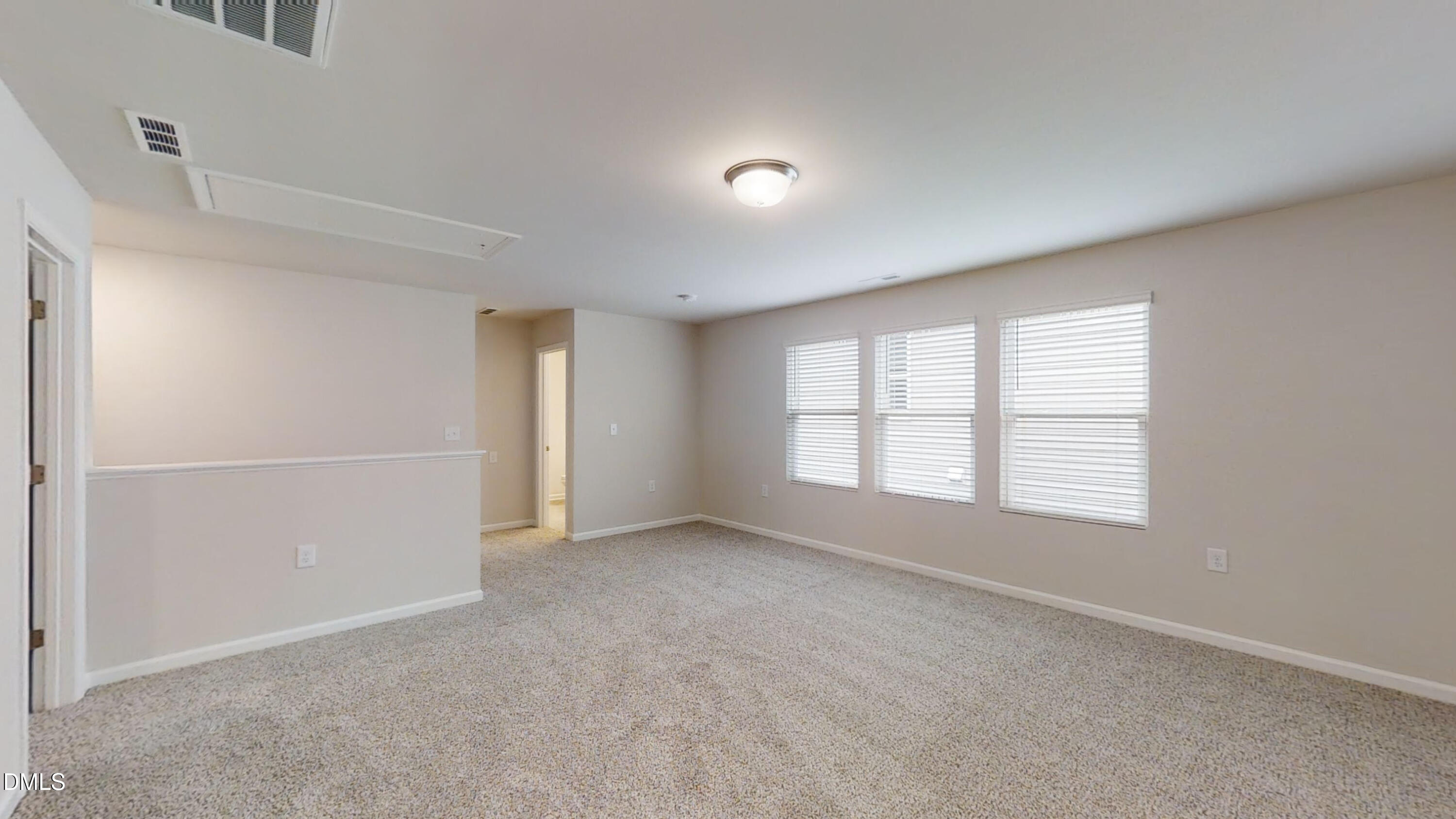 46 Coffee Tree Circle Clayton, NC 27527 - Photo 21 of 46 a view of an empty room with a window