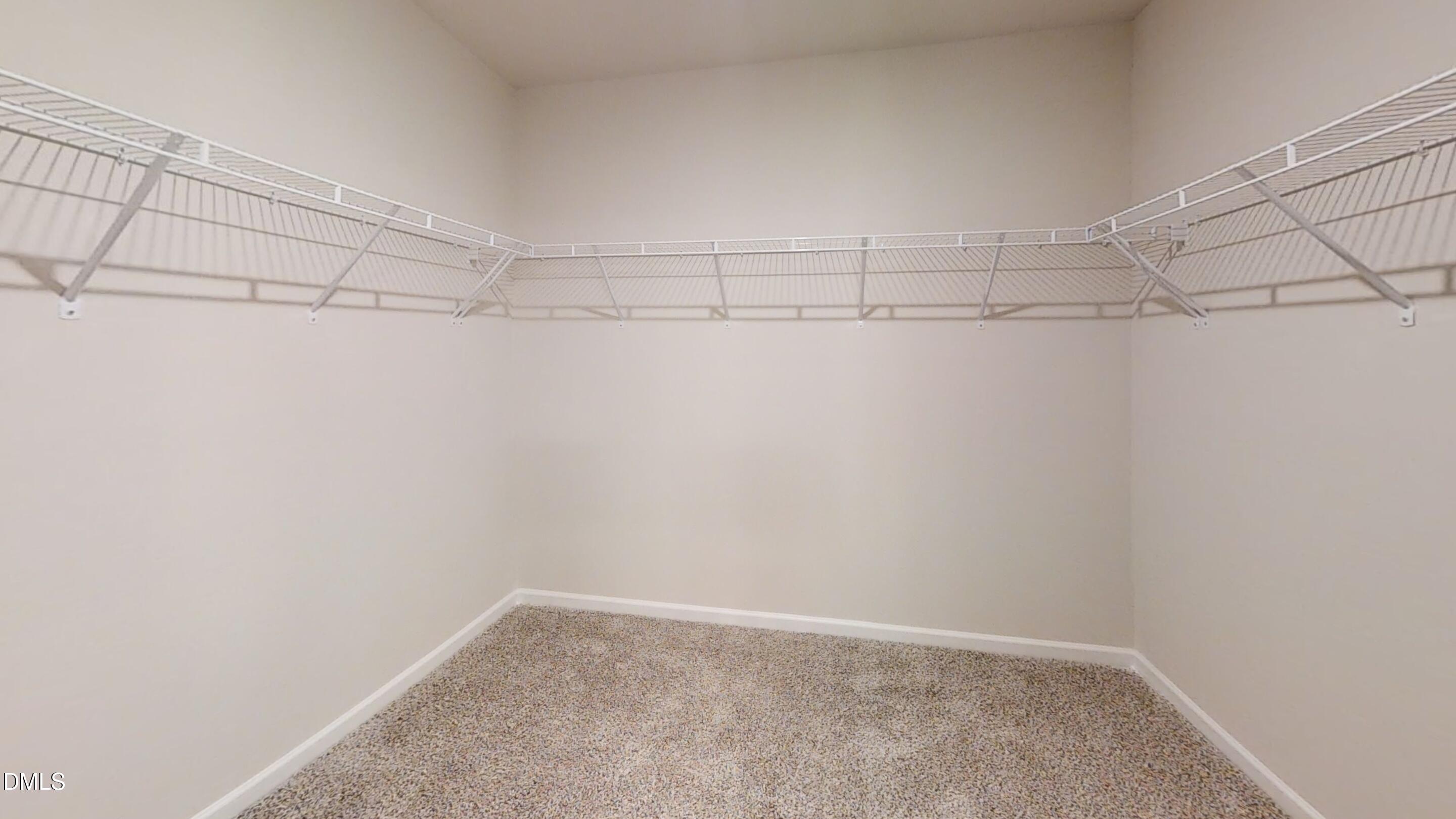 46 Coffee Tree Circle Clayton, NC 27527 - Photo 37 of 46 a view of a room with racks on the wall