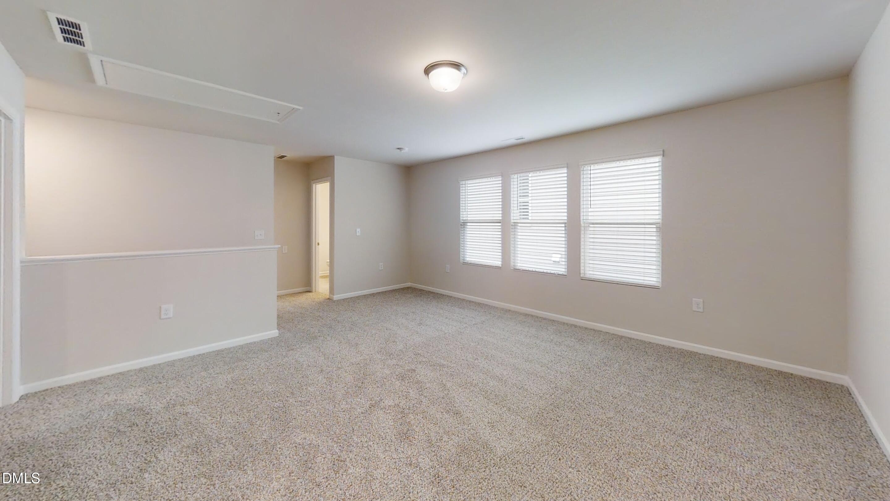 46 Coffee Tree Circle Clayton, NC 27527 - Photo 39 of 46 an empty room with windows