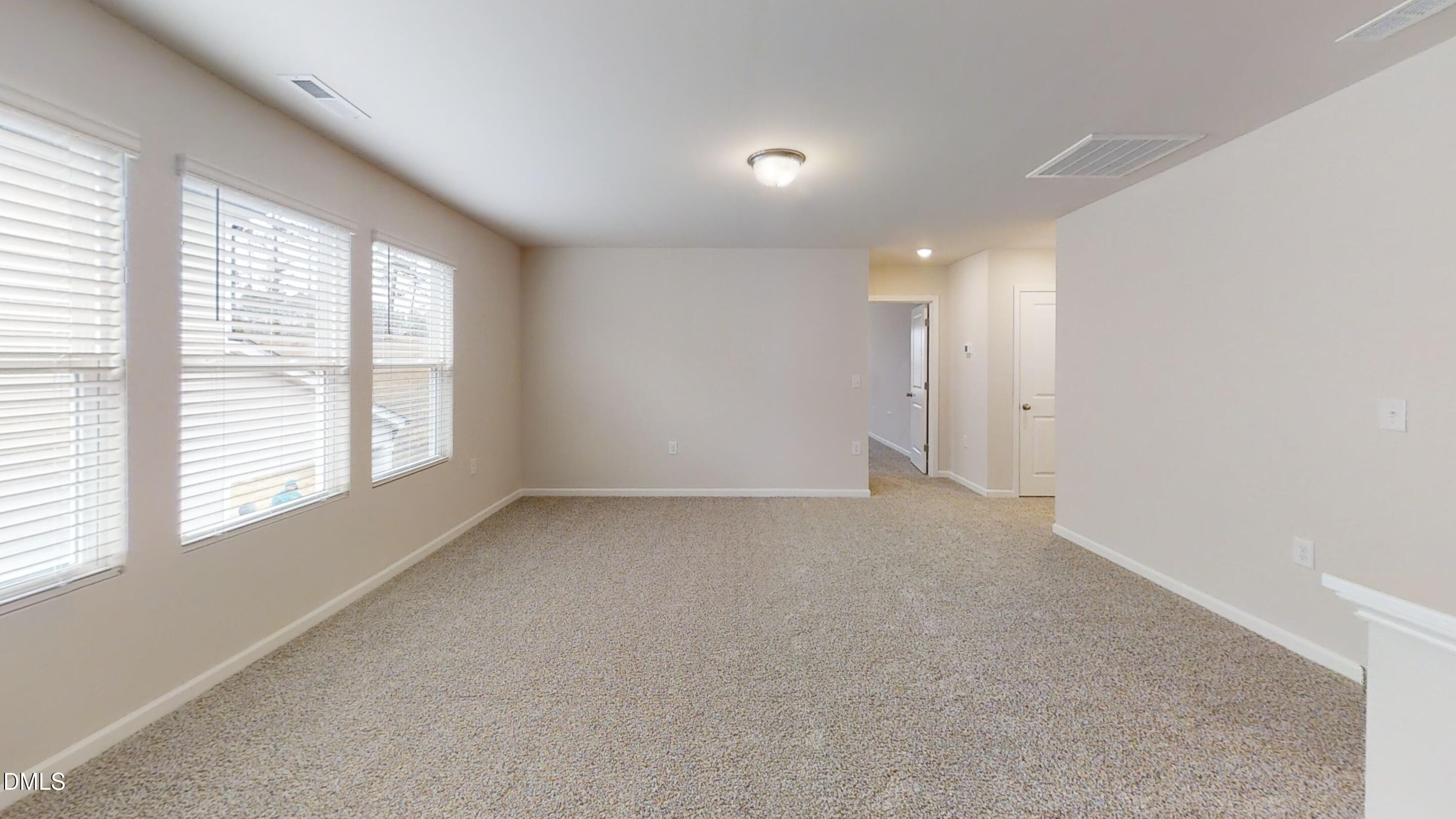 46 Coffee Tree Circle Clayton, NC 27527 - Photo 40 of 46 a view of an empty room with a window