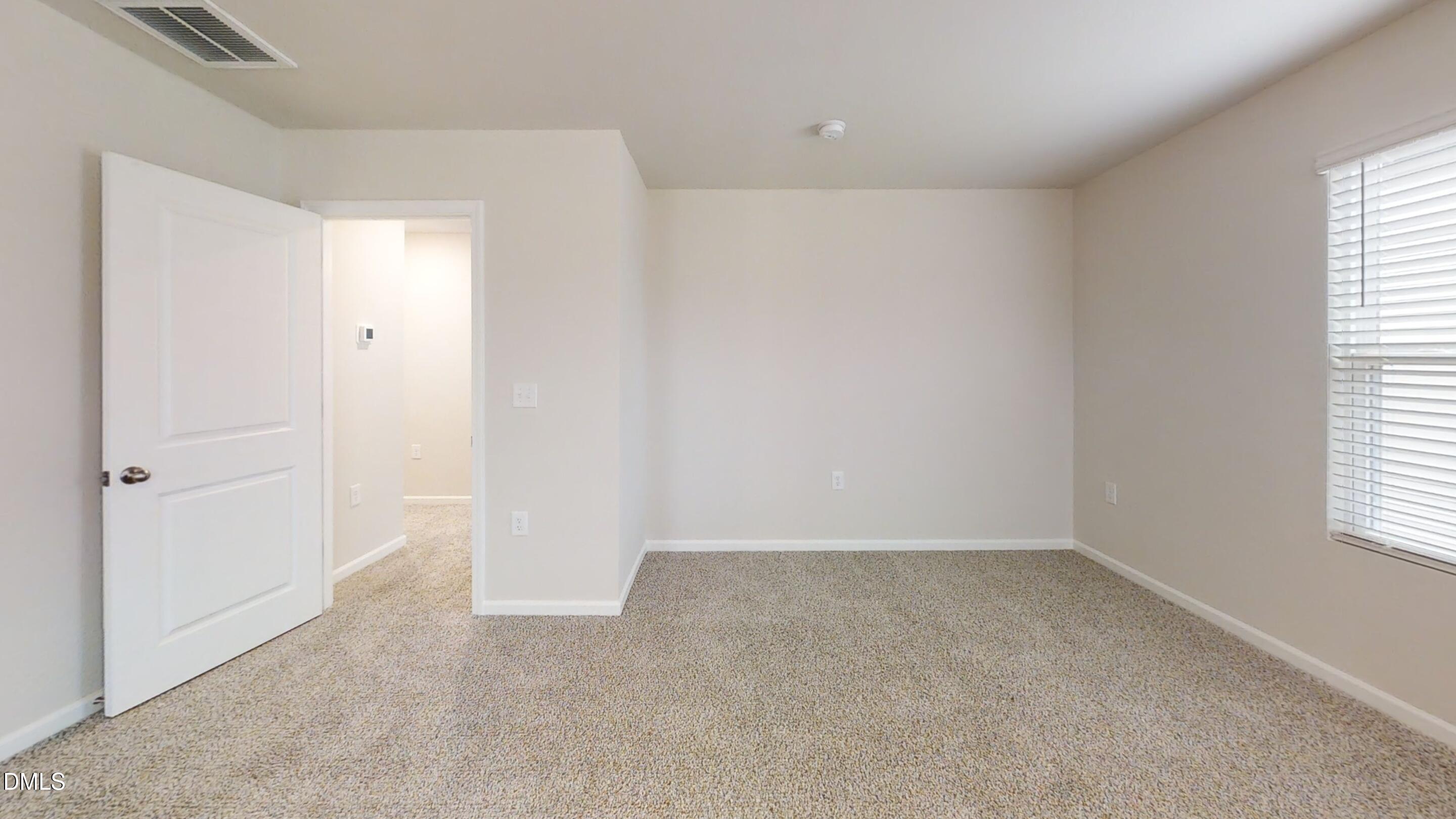 46 Coffee Tree Circle Clayton, NC 27527 - Photo 41 of 46 an empty room with windows