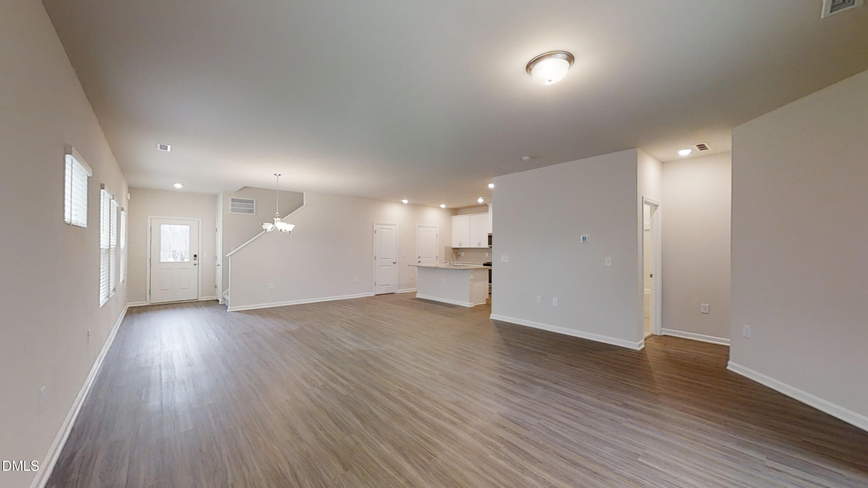 46 Coffee Tree Circle Clayton, NC 27527 - Photo 43 of 46 an empty room with wooden floor and windows