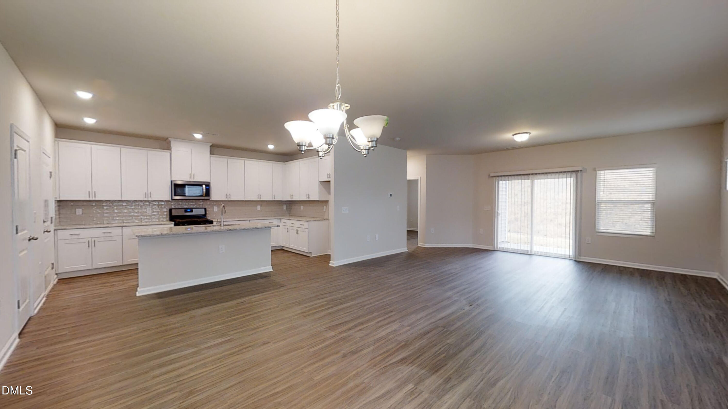 46 Coffee Tree Circle Clayton, NC 27527 - Photo 3 of 46 a view of a kitchen with sink and wooden floor