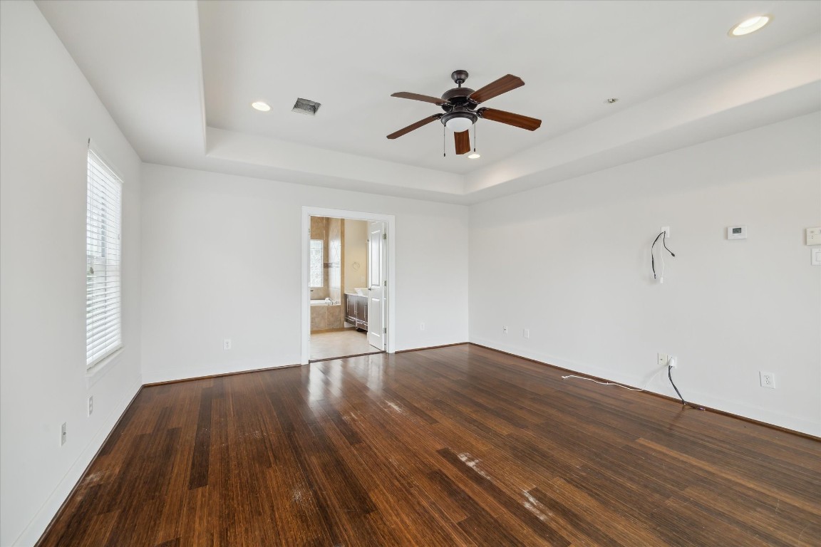 3041 Clinton Drive Houston, TX 77020 - Photo 15 of 29 a view of empty room with wooden floor and fan