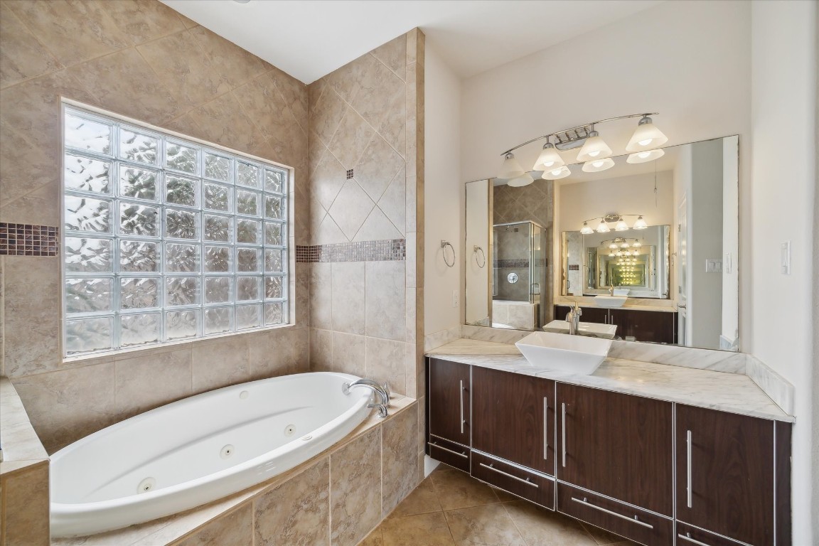 3041 Clinton Drive Houston, TX 77020 - Photo 17 of 29 a bathroom with a tub sink and mirror