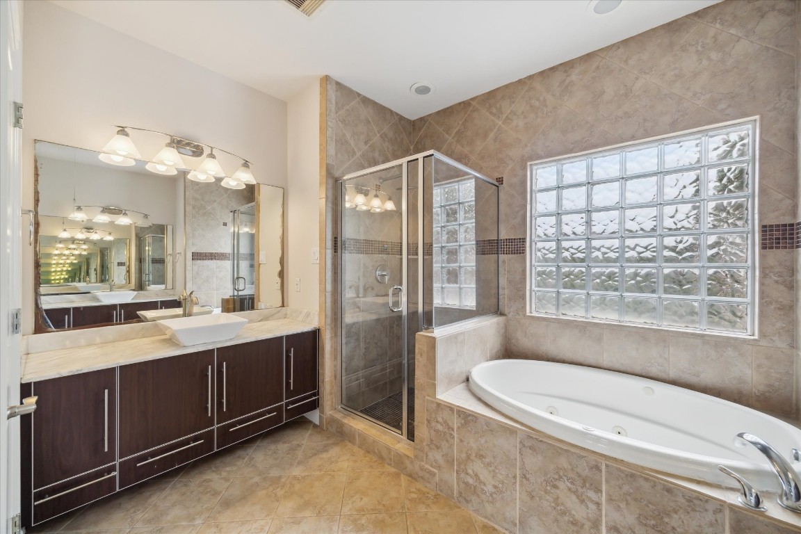 3041 Clinton Drive Houston, TX 77020 - Photo 18 of 29 a bathroom with a double vanity sink toilet and shower