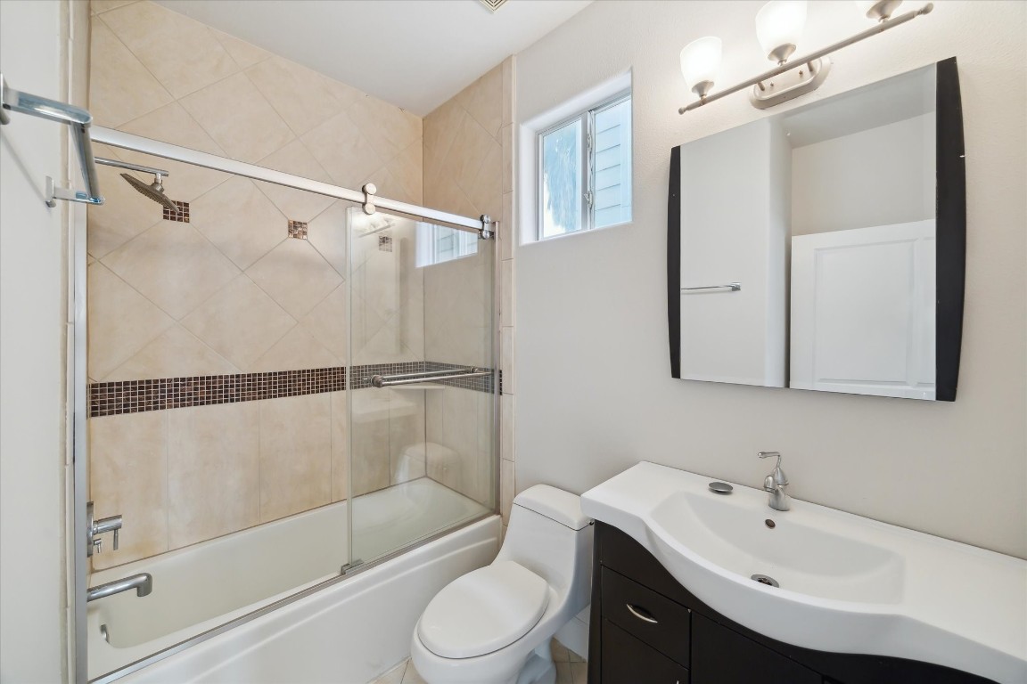 3041 Clinton Drive Houston, TX 77020 - Photo 22 of 29 a bathroom with a sink a toilet and shower
