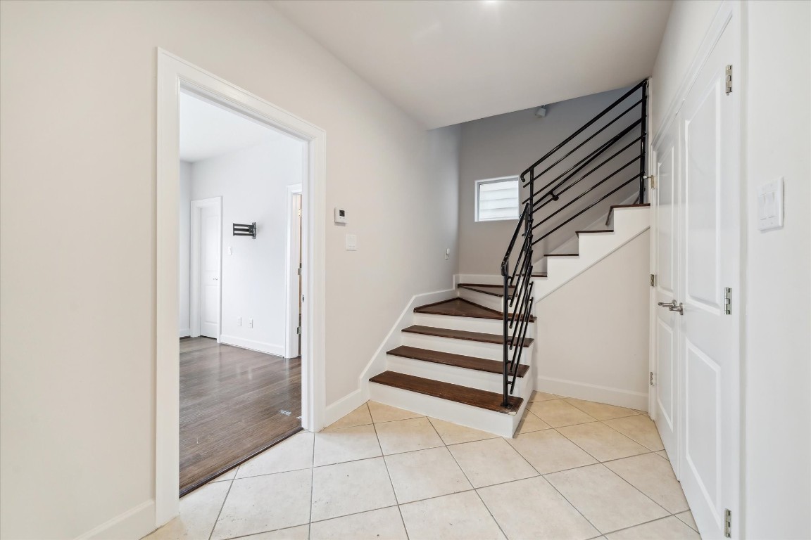 3041 Clinton Drive Houston, TX 77020 - Photo 4 of 29 a view of entryway and hall with wooden floor