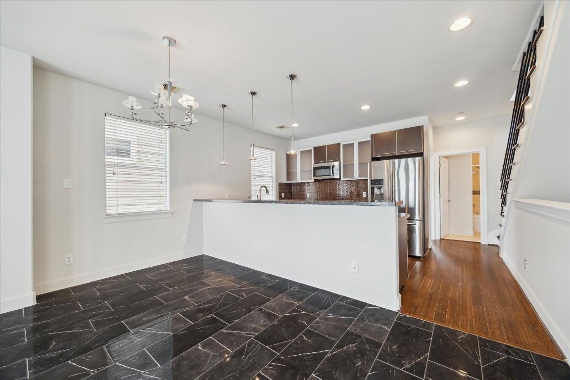 3041 Clinton Drive Houston, TX 77020 - Photo 9 of 29 a kitchen with stainless steel appliances granite countertop a refrigerator a oven and a sink with granite countertops